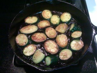 zucchini slices frying in olive oil