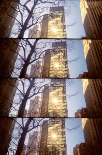 four panoramic images of downtown building reflecting the sun