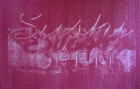 red gum bichromate print of neon sign reading sushi open